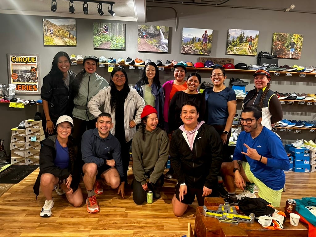 Trail race volunteers and race builders gathered at an aid station