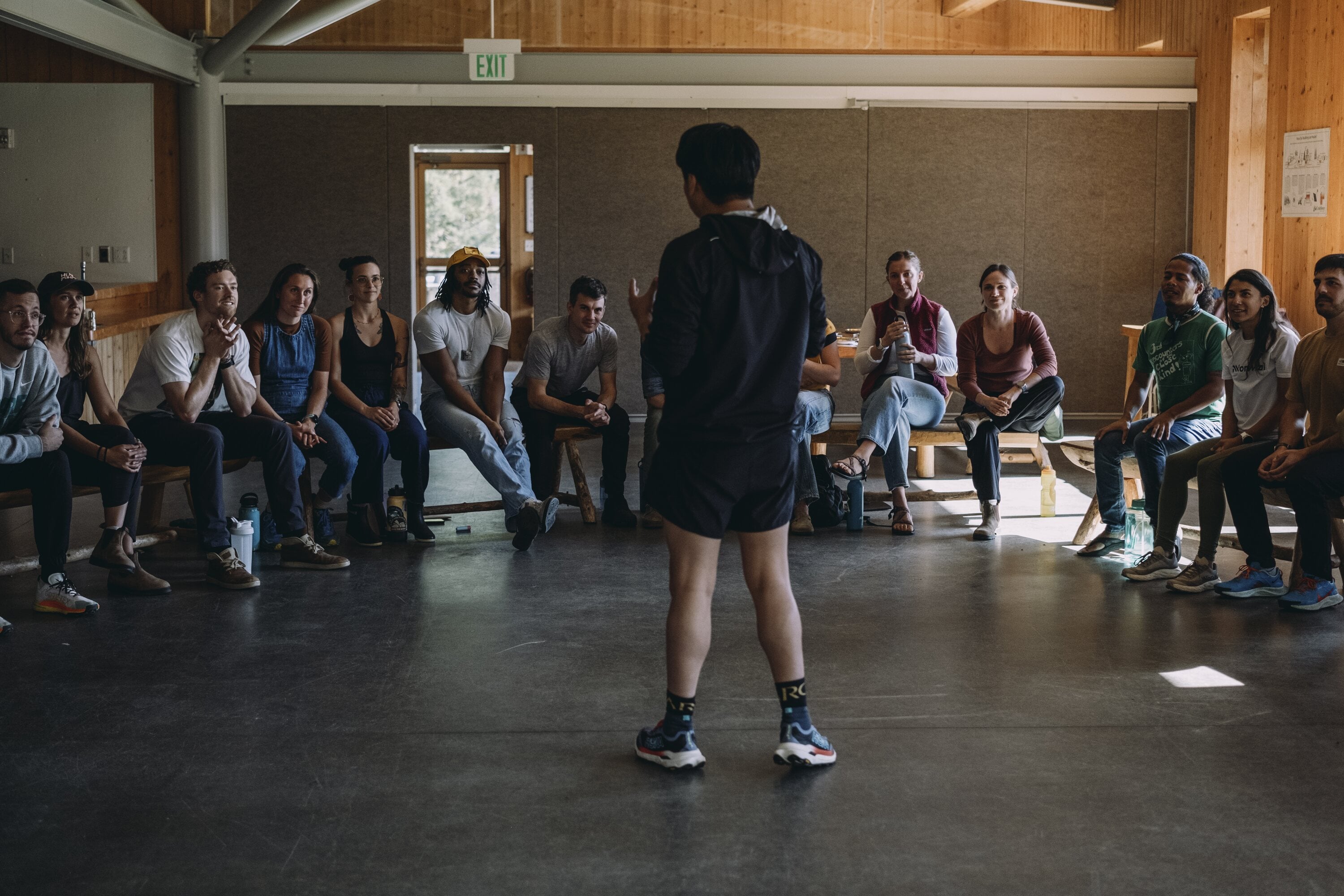 Runners and coaches gathered in a workshop space